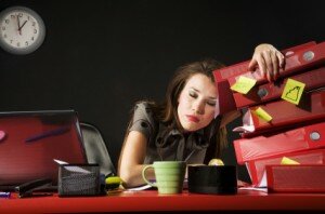 Business-Woman-Tired-At-Desk